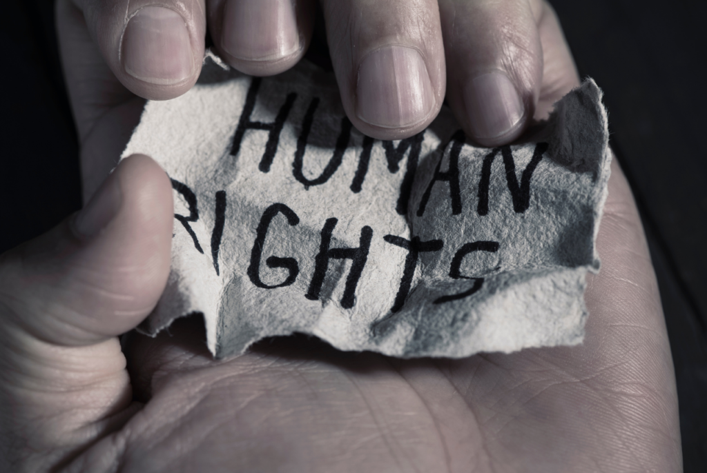 Picture crumpling piece of paper with the words HUMAN RIGHTS