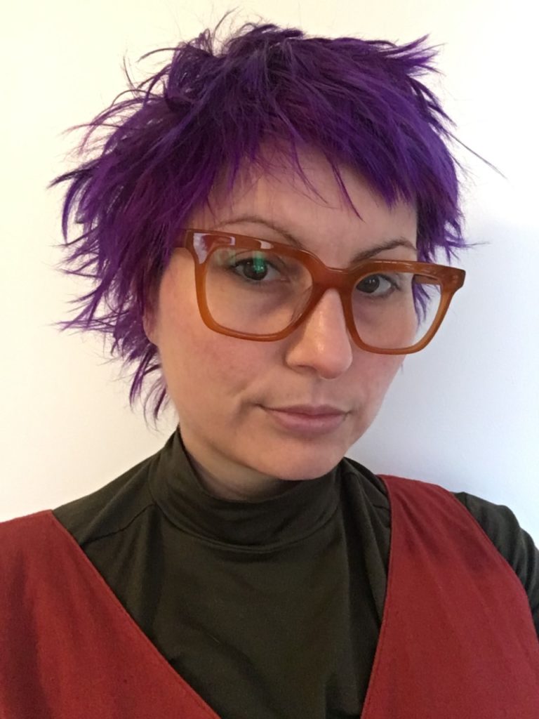 Anna with cool glasses and purple hair